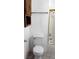 Compact bathroom featuring a toilet, tub-shower combo, and wall cabinet at 6733 E Carey Ave, Las Vegas, NV 89156