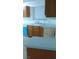 Kitchen featuring wood cabinets, blue accents, and a stainless steel sink at 6733 E Carey Ave, Las Vegas, NV 89156