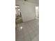Spacious living room with neutral walls and tile flooring throughout at 6733 E Carey Ave, Las Vegas, NV 89156