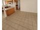 Kitchen opens to living room with tile flooring and ample natural light at 6733 E Carey Ave, Las Vegas, NV 89156