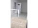 Empty living room area with white walls and tile flooring, bathed in natural light at 6733 E Carey Ave, Las Vegas, NV 89156