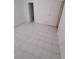 Neutral room with clean, white tile flooring and multiple doorways at 6733 E Carey Ave, Las Vegas, NV 89156
