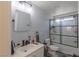 Well-lit bathroom with a shower-tub combo, updated fixtures and neutral color palette at 6924 Ghost Ranch Ave, Las Vegas, NV 89179