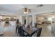 Open floor plan showcasing the kitchen and dining area with a ceiling fan and modern decor at 6924 Ghost Ranch Ave, Las Vegas, NV 89179