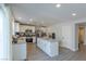Modern kitchen with stainless steel appliances, an island, and plenty of counter space at 6924 Ghost Ranch Ave, Las Vegas, NV 89179