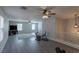 Open-concept living area featuring modern ceiling fans and wood-look flooring at 6924 Ghost Ranch Ave, Las Vegas, NV 89179