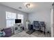 Bright home office with natural light, modern desk setup, and ample storage at 6924 Ghost Ranch Ave, Las Vegas, NV 89179