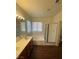 Bathroom featuring a double vanity, bath tub and shower combination at 731 Emerald Idol Pl, Henderson, NV 89011