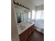 Bathroom with a double vanity, bright lighting, and a shower-tub combination at 731 Emerald Idol Pl, Henderson, NV 89011