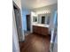 Modern bathroom featuring a double vanity, and a glass enclosed shower at 731 Emerald Idol Pl, Henderson, NV 89011