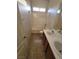Bathroom features a double vanity, toilet, and a shower-tub combination at 731 Emerald Idol Pl, Henderson, NV 89011