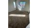 The bedroom features neutral walls, carpeting, and large windows that allow natural light to filter in at 731 Emerald Idol Pl, Henderson, NV 89011