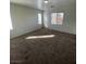 Bedroom with plush carpeting and two windows, offering natural light at 731 Emerald Idol Pl, Henderson, NV 89011