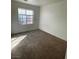 Bedroom with neutral carpeting, window and ample natural light at 731 Emerald Idol Pl, Henderson, NV 89011