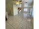 Bright living room featuring tile floors, ceiling fan, and ample natural light from large windows at 731 Emerald Idol Pl, Henderson, NV 89011