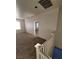 An open loft area featuring neutral walls, carpeting, and a view of the home's layout at 731 Emerald Idol Pl, Henderson, NV 89011