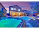 Backyard with pool and spa, perfect for relaxation, with lush landscaping and outdoor lighting at 765 Crimson Peak Pl, Henderson, NV 89011
