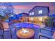 Inviting backyard features a pool, hot tub, fire pit, and covered patio ideal for entertaining at 765 Crimson Peak Pl, Henderson, NV 89011