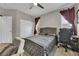 Relaxing bedroom with soft lighting, carpeting, and a work space at 765 Crimson Peak Pl, Henderson, NV 89011