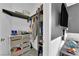 Walk-in closet with multiple storage shelves, hanging racks, and a modern organization system at 765 Crimson Peak Pl, Henderson, NV 89011