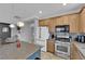 Modern kitchen with stainless steel appliances and a convenient center island at 765 Crimson Peak Pl, Henderson, NV 89011