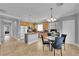 Beautiful kitchen and dining area features stainless steel appliances, tile floors, and an island at 765 Crimson Peak Pl, Henderson, NV 89011