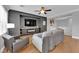 Comfortable living room with a fireplace, custom built-ins, and hardwood floors at 765 Crimson Peak Pl, Henderson, NV 89011
