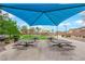 Community park with picnic tables, playground and large grassy area for residents to enjoy at 765 Crimson Peak Pl, Henderson, NV 89011