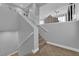 Carpeted staircase featuring a white handrail leading to the home's upper level at 765 Crimson Peak Pl, Henderson, NV 89011