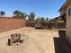 A full view of the expansive backyard featuring a fire pit and a chicken coop at 7732 Blackbird Ave, Las Vegas, NV 89145