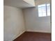 Small bedroom with peeling paint and window at 7732 Blackbird Ave, Las Vegas, NV 89145