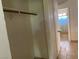 Walk in closet with tile floors leading to a bathroom at 7732 Blackbird Ave, Las Vegas, NV 89145