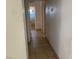 Hallway leading to a bathroom with tile flooring at 7732 Blackbird Ave, Las Vegas, NV 89145