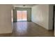 Living room with sliding glass doors to the back and tile floors at 7732 Blackbird Ave, Las Vegas, NV 89145