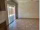 Living room featuring tile floors and sliding glass doors at 7732 Blackbird Ave, Las Vegas, NV 89145