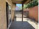 An outdoor patio area with stone flooring and a fenced yard at 7732 Blackbird Ave, Las Vegas, NV 89145