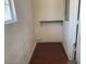 Small room featuring hardwood floors, one shelf and two windows at 7732 Blackbird Ave, Las Vegas, NV 89145