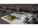 Aerial view of a home with a large yard, mature trees, and a multi-car garage at 7797 Hauck St, Las Vegas, NV 89139