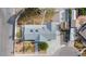 Bird's eye view of the property showcasing its roof, backyard with white fencing, and surrounding neighborhood at 7797 Hauck St, Las Vegas, NV 89139