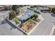 An aerial view of a home with a well-maintained front yard, spacious backyard, and charming neighborhood setting at 7797 Hauck St, Las Vegas, NV 89139