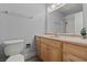 Bathroom featuring a single sink vanity with modern fixtures and a combined shower and bathtub at 7797 Hauck St, Las Vegas, NV 89139