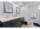 Modern bathroom with dual sinks, granite countertops and a sleek, updated design at 7797 Hauck St, Las Vegas, NV 89139