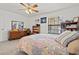 Bright bedroom with floral bedding, natural light, and a ceiling fan at 7797 Hauck St, Las Vegas, NV 89139