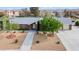 Charming single-story home with a well-manicured, xeriscaped front yard and a brick exterior at 7797 Hauck St, Las Vegas, NV 89139