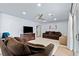 Comfortable living room with plush seating, a ceiling fan and access to the outdoor patio at 7797 Hauck St, Las Vegas, NV 89139