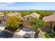 Aerial view of a home with lush landscaping and tile roof at 812 Eaglewood Dr, Las Vegas, NV 89144