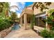 This backyard features a waterfall feature, lush garden, and covered patio at 812 Eaglewood Dr, Las Vegas, NV 89144