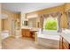 Bathroom features shower, tub, double sinks, vanity, and great light at 812 Eaglewood Dr, Las Vegas, NV 89144