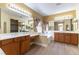 Bright bathroom features dual vanities, soaking tub, and large mirror at 812 Eaglewood Dr, Las Vegas, NV 89144