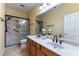 Bathroom featuring double sinks, vanity with shower at 812 Eaglewood Dr, Las Vegas, NV 89144